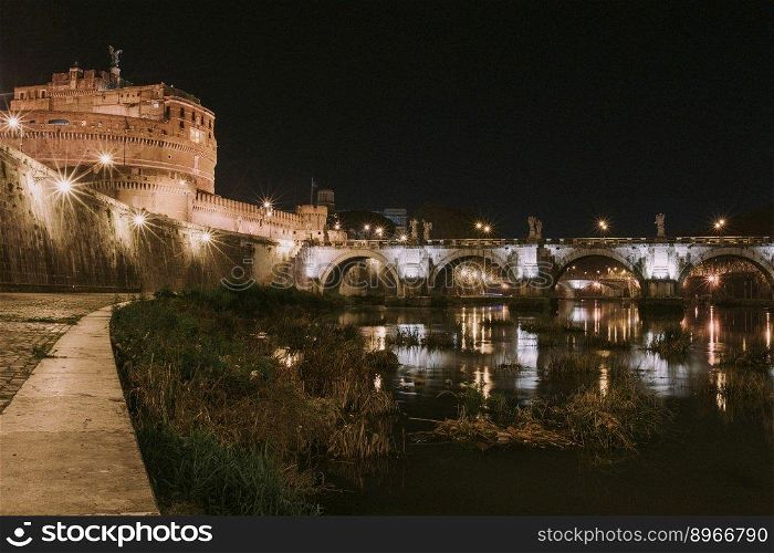 Rome, Italy, the bridge in the night city is beautifully illuminated