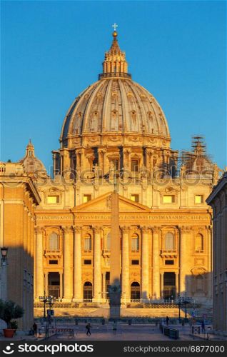Rome. Saint Peter&rsquo;s Cathedral.. A view in the rays of the rising sun on dome of St. Peter&rsquo;s Cathedral. Rome. Vatican. Italy.
