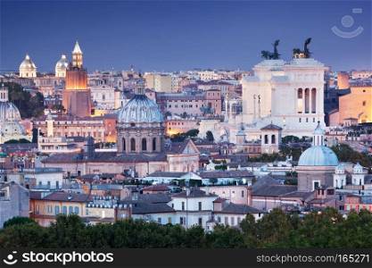 Rome skyline at night, Italy. Seen from Piazza Giuseppe Garibaldi. The Altare della Patria monument on the right.. Ultra wide panorama of Rome, Italy. 
