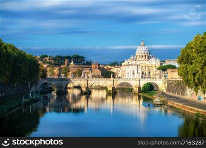 Rome Skyline with Vatican St Peter Basilica of Vatican and St Angelo Bridge crossing Tiber River in the city center of Rome Italy. It is historic landmark of the Ancient Rome and travel destination.