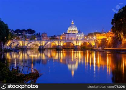 Rome. The Tiber River and Saint Peter's Cathedral.. Night view of the Tiber River and St. Peter's Cathedral in the Vatican. Italy.