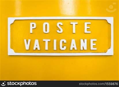 ROME, VATICAN STATE - AUGUST 19, 2018: Detail of the traditional yellow post box in Vatican City, Rome