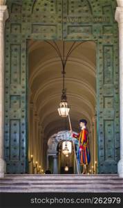 ROME, VATICAN STATE - August 24, 2018: Pontifical Swiss Guard at the entrance of the Vatican State