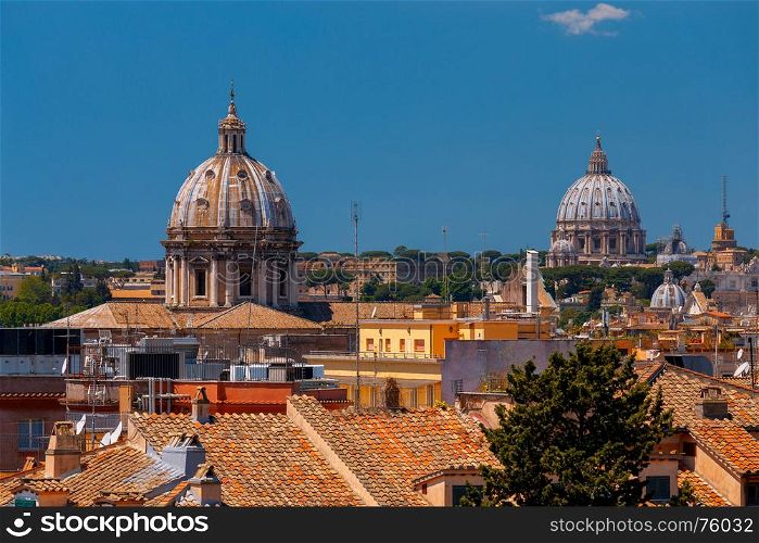 Rome. View of the old town.. A view of the tiled roofs and an antique arch in the old town. Rome. Italy.