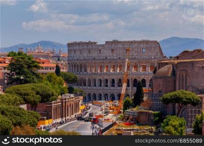 Rome. View of the old town.. A view on Colosseum and an antique arch in the old town. Rome. Italy.