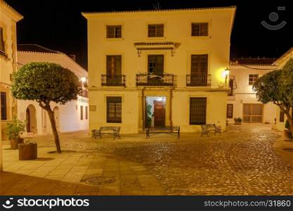 Ronda. Village street at night.. Traditional narrow village street with glowing lanterns in Ronda. Spain. Andalusia.