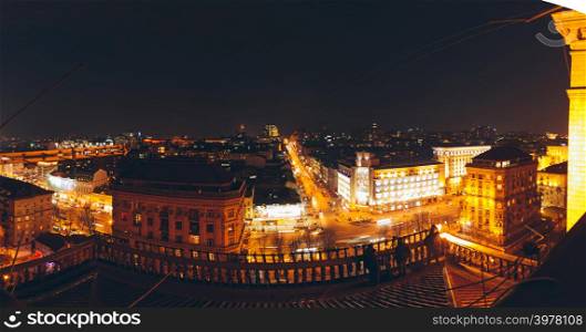 Roof aerial view of center of city, shoted in night with old illuminated houses