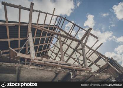 Roof construction with wooden planks in the blye sky