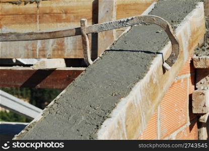 roof house under construction (cement and brick wall)