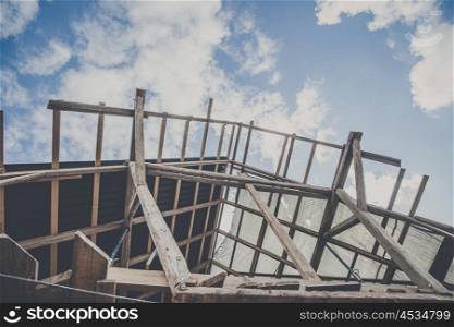Roof improvement with structure made of wood in blue sky