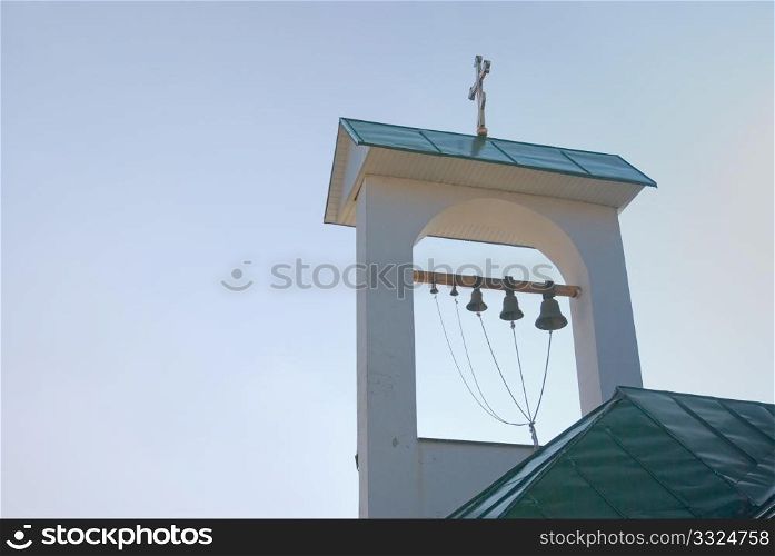 roof of the Greek church belfry against the suny sky