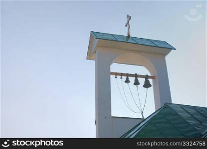 roof of the Greek church belfry against the suny sky
