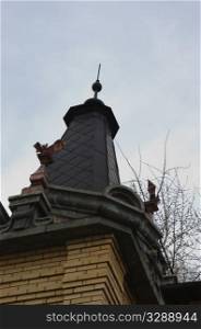 roof of the tower is decorated with sculptures