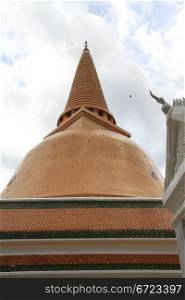 Roof of white temple and Chedi Phra Pathom in Thailand