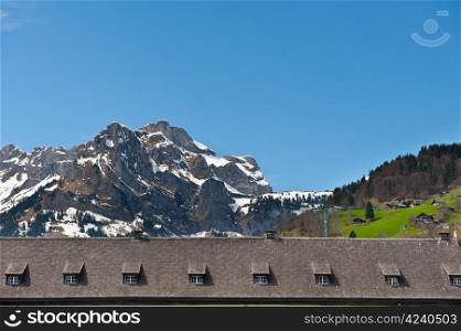 Roof on the Background of Snow-capped Alps, Switzerland