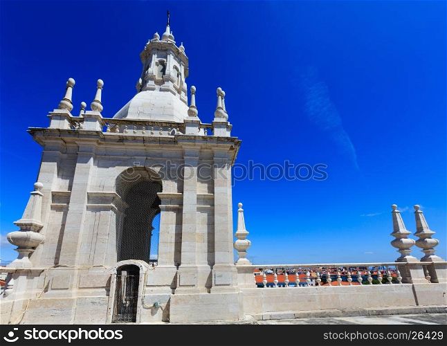 Roof with white bell tower on blue sky background. Monastery of St. Vincent Outside the Walls, or Church (Iglesia) de Sao Vicente de Fora in Lisbon, Portugal.