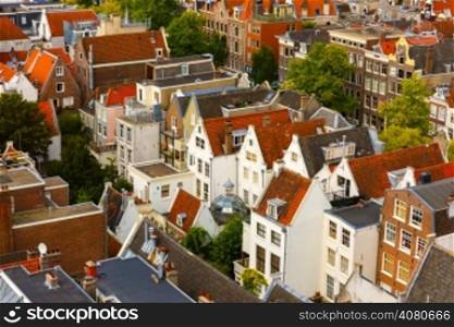 Roofs and facades of Amsterdam. City view from the bell tower of the church Westerkerk, Holland, Netherlands.