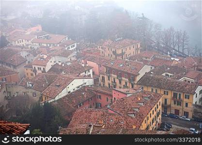 Roofs covered with fog in Verona, Italy