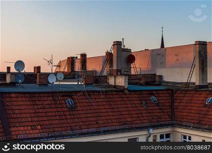Roofs of townhouses (row houses) in Europe in the afternoon
