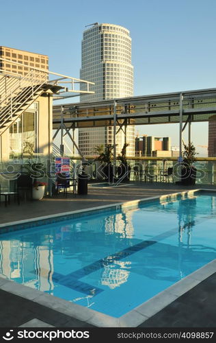 Rooftop swimming pool has a skyscraper view