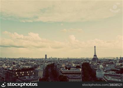 Rooftop view on the Eiffel Tower from Arc de Triomphe. Sunny day, blue sky. Tour Eiffel. Vintage, retro style