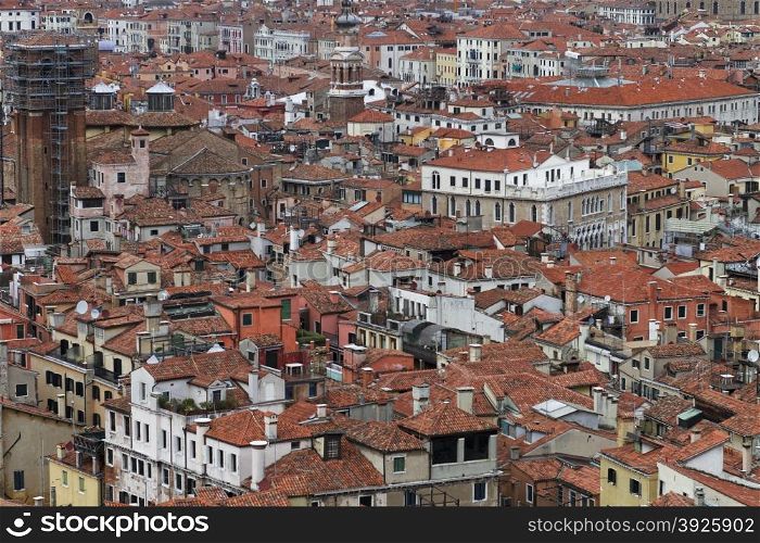 Rooftop views of canals and ancient architecture in Venice, Italy. Venice is a city in northeastern Italy sited on a group of 118 small islands separated by canals and linked by bridges.