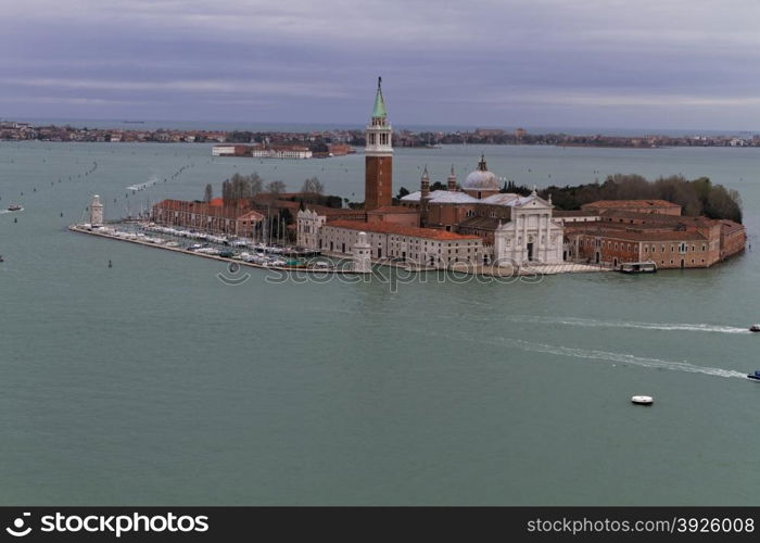 Rooftop views of canals and ancient architecture in Venice, Italy. Venice is a city in northeastern Italy sited on a group of 118 small islands separated by canals and linked by bridges.