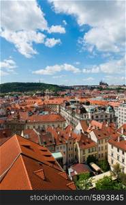 Rooftops in Prague on bright summer day
