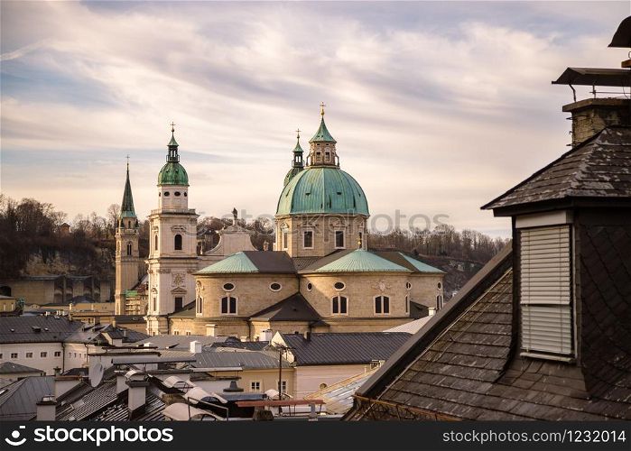 Rooftops of Salzburger Cathedral, Houses and Churches in the evening. Stunning atmosphere.