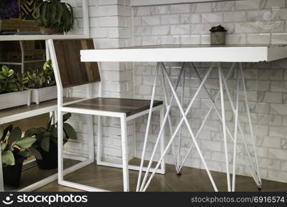 Room ambiance with white metal table and chair, stock photo