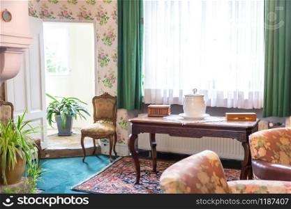 Room interior with vintage antique furniture, Europe. Ancient european architecture and style, famous places for travel and tourism, historical heritage