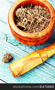 Roots and rhizomes Valerian officinalis. Traditional remedy from valerian roots in a mortar.Herbal medicine