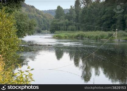 rope at the semois river crossing near the place auby for survival Belgian Ardennes