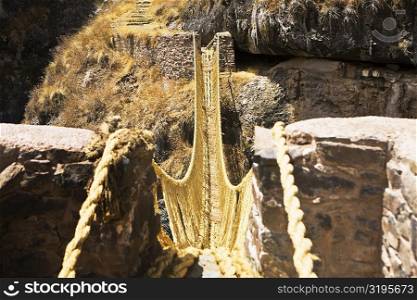 Rope bridge across a mountain, Queswachaca, Peru