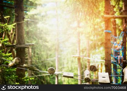 rope bridge in climbing forest or high wire park and nature background