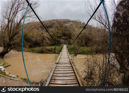 rope bridge over wild river