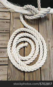 Rope of boat tied to a jetty cleat