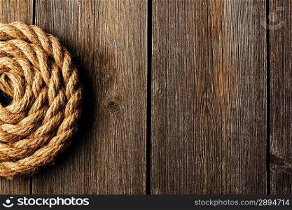 Rope over old wooden background
