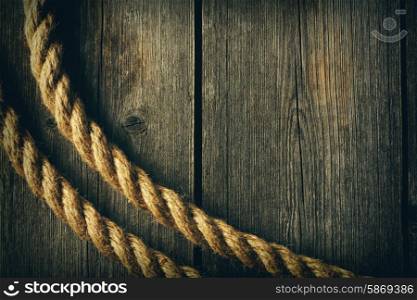 Rope over old wooden background