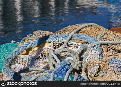 ropes and fishing net on the dock at the sun