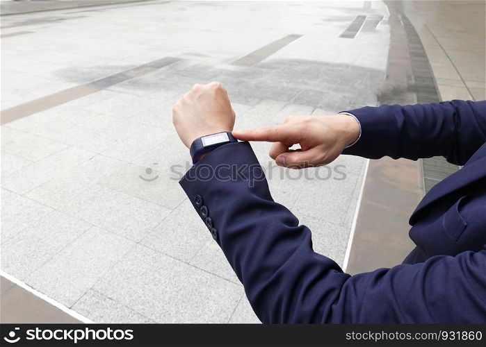 ropped image of hands with smartwatch