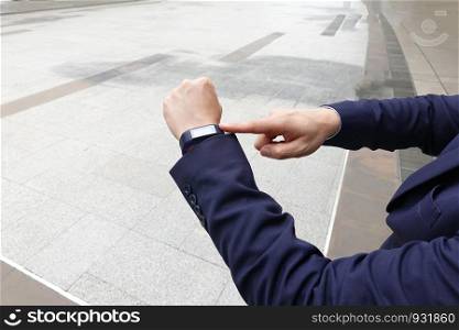 ropped image of hands with smartwatch