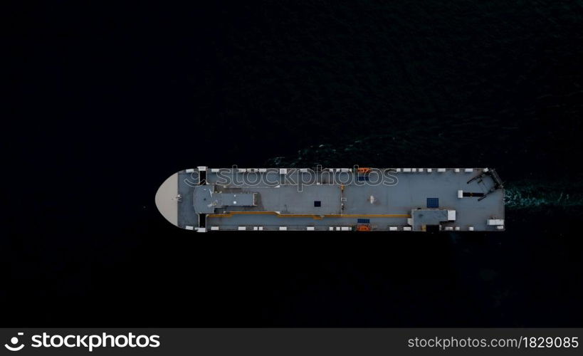 roro ship sailing in the dark sea aerial top view transportation international concept