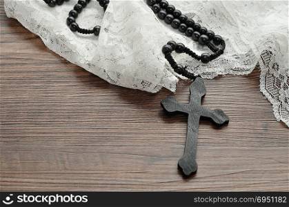 Rosary beads with a white chapel veil