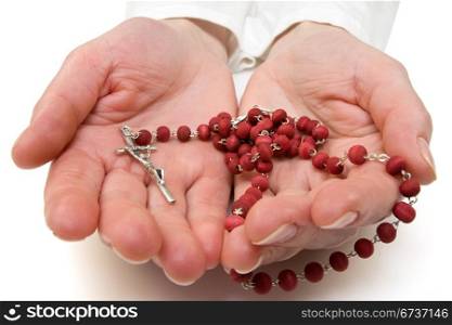 rosary in the woman hands. isolated on white.