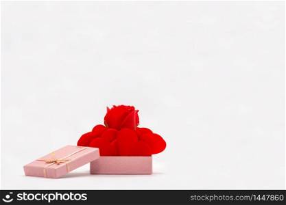 Rose and Red Hearts in a Gift Box. Isolated on white background. Valentines Day Theme. Symbol of Love and Friendship