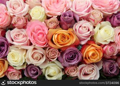 Rose arrangement for a wedding: different sized roses in various pastel shades