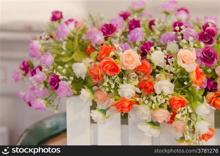 rose flower. Bouquet of plastic roses and in ceramic vase