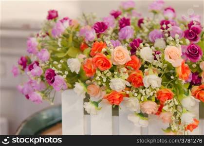 rose flower. Bouquet of plastic roses and in ceramic vase