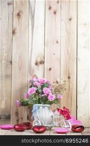 rose flower on wooden wall background